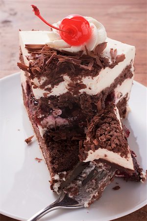 simsearch:659-01848790,k - Piece of Black Forest gateau with cherry Stock Photo - Premium Royalty-Free, Code: 659-01846292