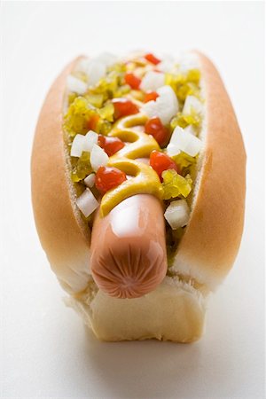 snacks hot dog - Hot dog with relish, mustard, ketchup and onions Stock Photo - Premium Royalty-Free, Code: 659-01847324