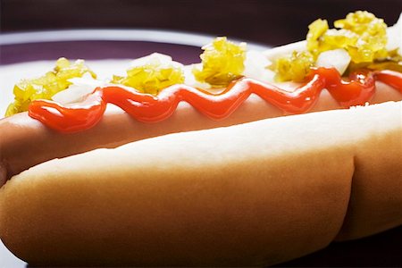 snacks hot dog - Hot dog with relish, ketchup and onions Stock Photo - Premium Royalty-Free, Code: 659-01847334