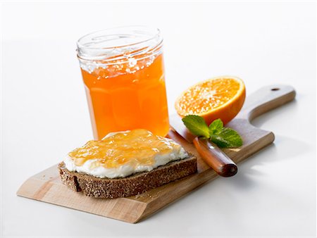 Orange jelly on bread and in jar Stock Photo - Premium Royalty-Free, Code: 659-01849015