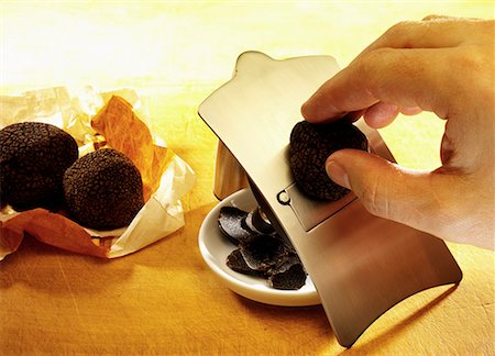 Black truffle being sliced Stock Photo - Premium Royalty-Free, Code: 659-01849111