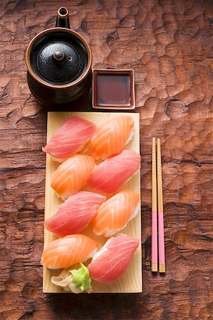 simsearch:659-07610354,k - Nigiri sushi with tuna and salmon on sushi board Stock Photo - Premium Royalty-Free, Code: 659-01849630