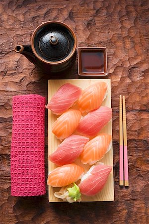 simsearch:659-07610354,k - Nigiri sushi with tuna and salmon on sushi board Stock Photo - Premium Royalty-Free, Code: 659-01849631