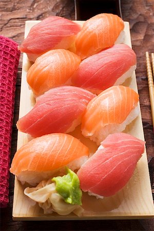 simsearch:659-07610354,k - Nigiri sushi with tuna and salmon on sushi board Stock Photo - Premium Royalty-Free, Code: 659-01849632