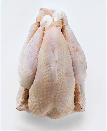 An Uncooked Roasting Chicken Stock Photo - Premium Royalty-Free, Code: 659-01842572