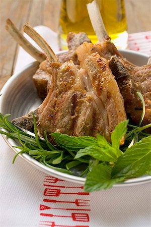 simsearch:659-06186142,k - Grilled lamb cutlets, fresh herbs olive oil Stock Photo - Premium Royalty-Free, Code: 659-01857132