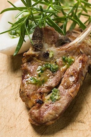 simsearch:659-06186142,k - Grilled lamb cutlets with herb oil and rosemary Stock Photo - Premium Royalty-Free, Code: 659-01857274