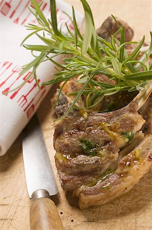 simsearch:659-06186142,k - Grilled lamb cutlets with herb oil and rosemary Stock Photo - Premium Royalty-Free, Code: 659-01857276