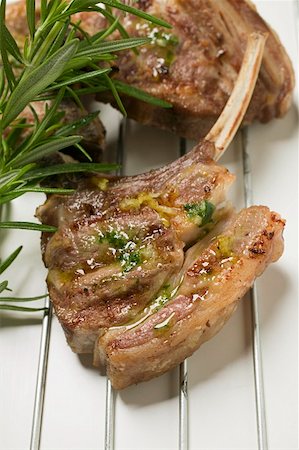 simsearch:659-06186142,k - Grilled lamb cutlets with herb oil and rosemary Stock Photo - Premium Royalty-Free, Code: 659-01857271