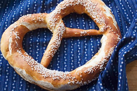 soft pretzel food photography - A Bavarian salted pretzel Stock Photo - Premium Royalty-Free, Code: 659-01857378