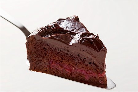 simsearch:659-01848790,k - Slice of chocolate cake on cake server Stock Photo - Premium Royalty-Free, Code: 659-01857953