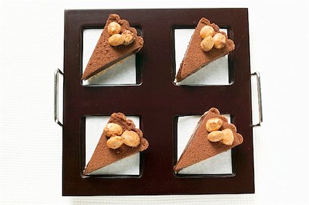 simsearch:659-01848790,k - Four pieces of chocolate tart with almonds on tray Stock Photo - Premium Royalty-Free, Code: 659-01859313