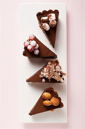 simsearch:659-01848790,k - Four pieces of chocolate tart with different decorations Stock Photo - Premium Royalty-Free, Code: 659-01859353