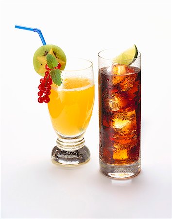 Orangeade garnished with fruit, cola with ice cubes Stock Photo - Premium Royalty-Free, Code: 659-01850529