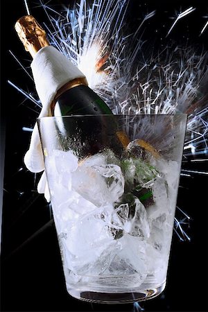 Sparkling wine still life: cooler bottle & shower of sparks Stock Photo - Premium Royalty-Free, Code: 659-01852354