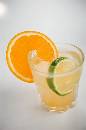 simsearch:652-03802277,k - Aperitif with orange and lime Stock Photo - Premium Royalty-Free, Code: 659-01853659