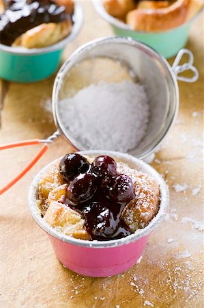simsearch:659-02213122,k - Individual bread puddings with cherries & icing sugar Stock Photo - Premium Royalty-Free, Code: 659-01853763