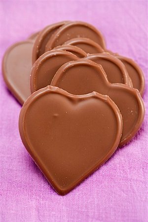 simsearch:659-06151276,k - Chocolate hearts on purple background Stock Photo - Premium Royalty-Free, Code: 659-01864467