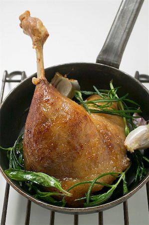 simsearch:659-01857024,k - Fried goose leg with rosemary in frying pan Stock Photo - Premium Royalty-Free, Code: 659-01865558