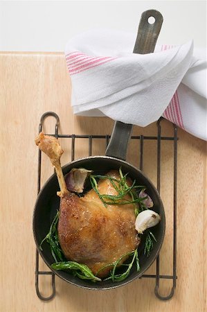 simsearch:659-01857024,k - Fried goose leg with rosemary in frying pan (overhead view) Stock Photo - Premium Royalty-Free, Code: 659-01865559