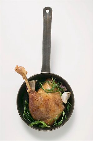 simsearch:659-01857024,k - Fried goose leg with rosemary in frying pan (overhead view) Stock Photo - Premium Royalty-Free, Code: 659-01865560