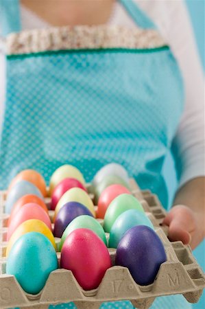 simsearch:659-03536847,k - Woman holding egg tray full of coloured Easter eggs Foto de stock - Sin royalties Premium, Código: 659-01865754