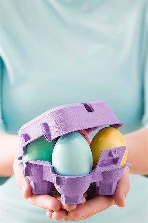 simsearch:659-03536847,k - Woman holding egg box full of coloured Easter eggs Foto de stock - Sin royalties Premium, Código: 659-01865779