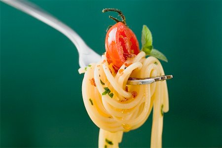 fork with noodles - Spaghetti with cherry tomato on fork Stock Photo - Premium Royalty-Free, Code: 659-01866417