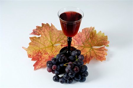 simsearch:659-06493733,k - Glass of red wine, black grapes, variety Trollinger, leaves Stock Photo - Premium Royalty-Free, Code: 659-01861225