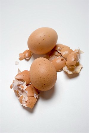 simsearch:659-03536847,k - Two brown eggs on broken eggshells Foto de stock - Sin royalties Premium, Código: 659-01861655