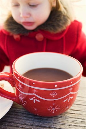 Small girl behind large cup of cocoa Stock Photo - Premium Royalty-Free, Code: 659-01861786