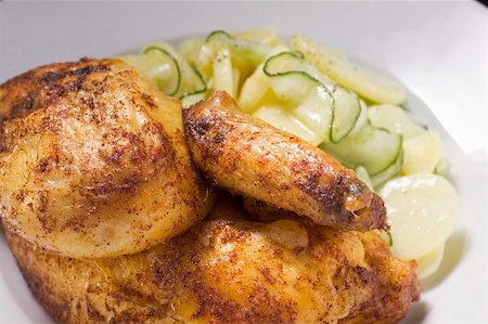 simsearch:659-01857024,k - Half a roast chicken with potato and cucumber salad Stock Photo - Premium Royalty-Free, Code: 659-01862227