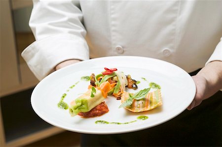 plated food - Waiter serving three pasta variations on plate Stock Photo - Premium Royalty-Free, Code: 659-01863303