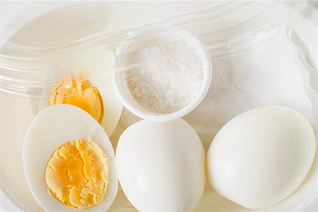 Boiled eggs and salt in plastic food storage container Stock Photo - Premium Royalty-Free, Code: 659-01863775