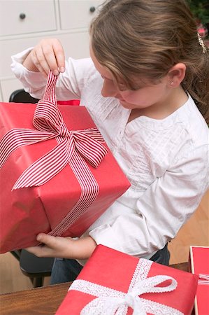 simsearch:659-03526649,k - Girl opening Christmas parcel Stock Photo - Premium Royalty-Free, Code: 659-02214332