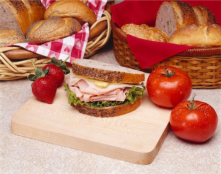 rye bread - Ham and Swiss with Mustard on Rye Bread on a Small Cutting Board Stock Photo - Premium Royalty-Free, Code: 659-02211555