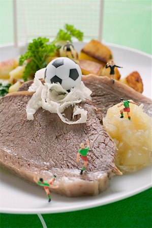 Boiled beef with accompaniments and football figures Stock Photo - Premium Royalty-Free, Code: 659-02213089