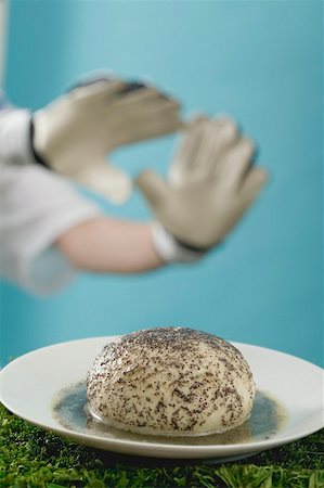 simsearch:659-01850806,k - Yeast dumpling with poppy seeds, footballer in background Stock Photo - Premium Royalty-Free, Code: 659-02213117