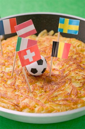 simsearch:659-02213122,k - Rösti with toy football and European flags in frying pan Stock Photo - Premium Royalty-Free, Code: 659-02213134