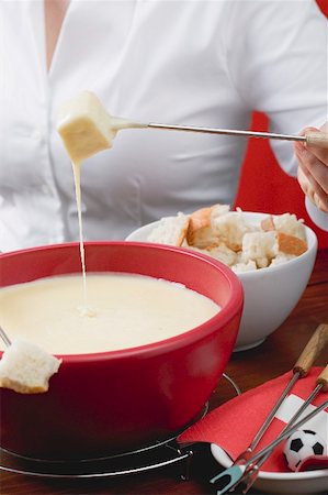 simsearch:659-02213122,k - Woman eating cheese fondue Stock Photo - Premium Royalty-Free, Code: 659-02213147