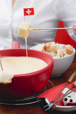 simsearch:659-02213122,k - Woman eating cheese fondue Stock Photo - Premium Royalty-Free, Code: 659-02213149