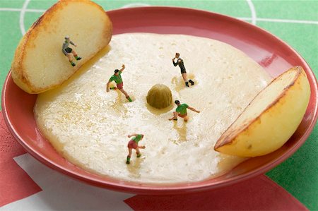 simsearch:659-02213122,k - Raclette with potatoes, gherkin and toy footballers Stock Photo - Premium Royalty-Free, Code: 659-02213161