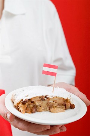 simsearch:659-02213122,k - Woman holding piece of apple strudel with Austrian flag on plate Stock Photo - Premium Royalty-Free, Code: 659-02213198