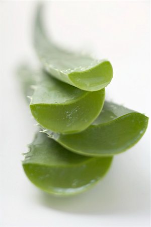 Four Aloe vera leaves, in a pile Stock Photo - Premium Royalty-Free, Code: 659-02213252