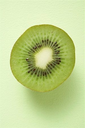 Half a kiwi fruit (overhead view) Stock Photo - Premium Royalty-Free, Code: 659-02213459