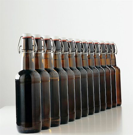 A row of beer bottles with swing top closures Stock Photo - Premium Royalty-Free, Code: 659-03524198