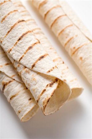 rolled up - Unfilled tortilla rolls Stock Photo - Premium Royalty-Free, Code: 659-03524473