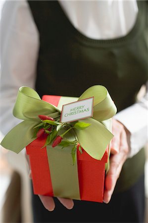 simsearch:659-03526649,k - Woman holding Christmas gift Stock Photo - Premium Royalty-Free, Code: 659-03524620