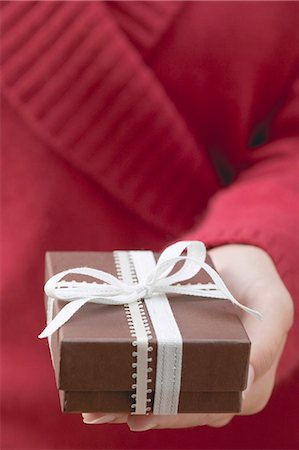 simsearch:659-03526649,k - Woman holding gift box with ribbon Stock Photo - Premium Royalty-Free, Code: 659-03525097
