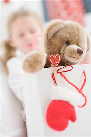 simsearch:659-03526649,k - Teddy bear in carrier bag, girl in background Stock Photo - Premium Royalty-Free, Code: 659-03525506